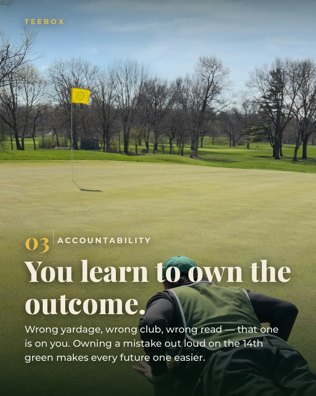 A caddie in a green bib reading a putt from behind the green