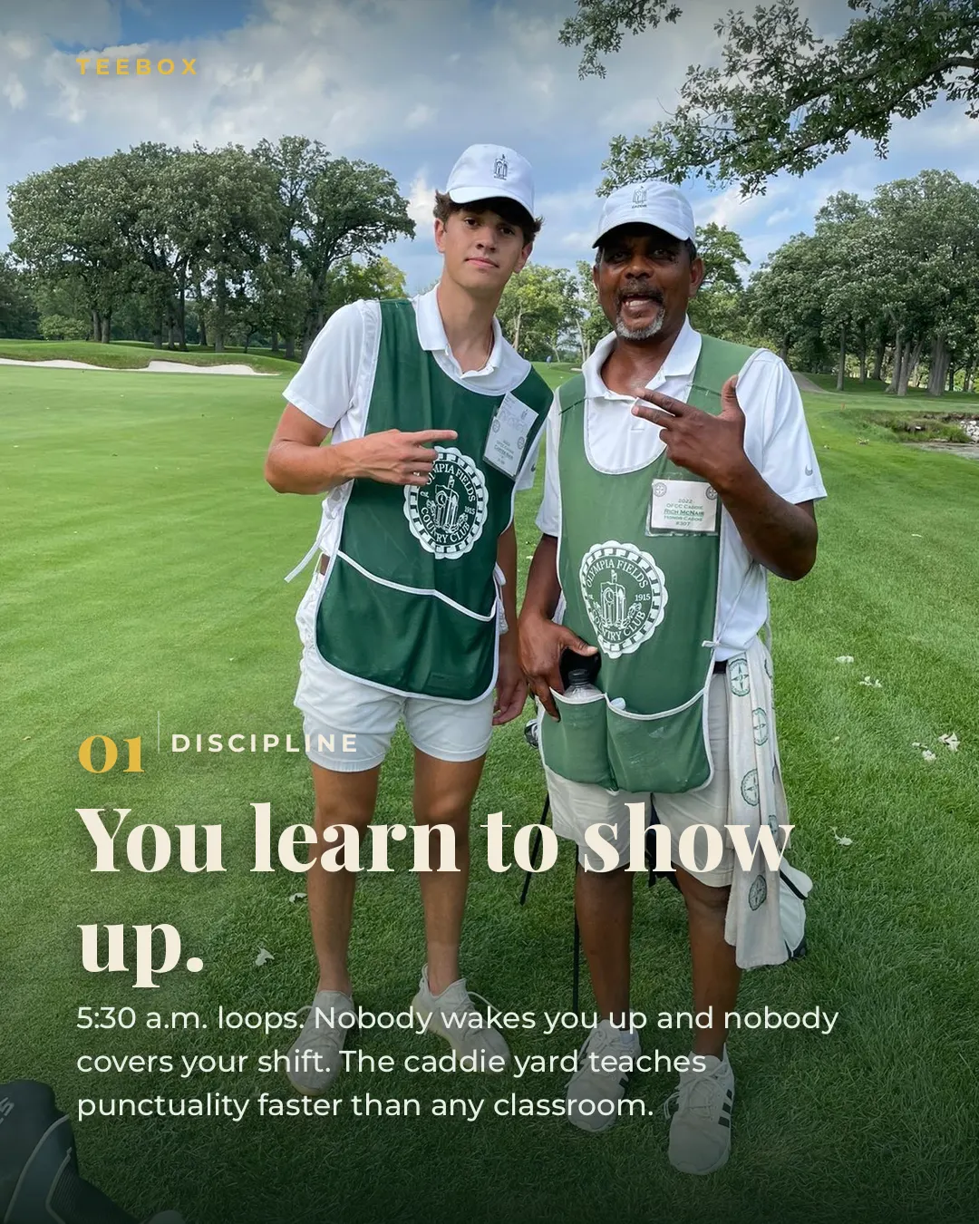 Two caddies in Olympia Fields Country Club bibs on the fairway