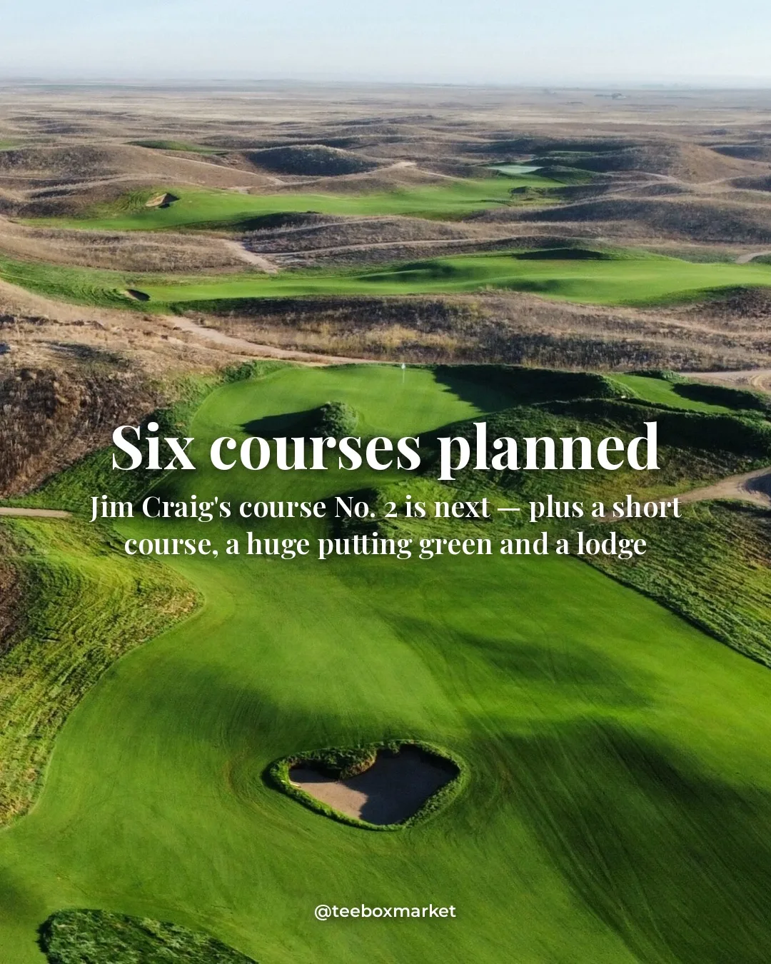 Aerial of a green fairway and heart-shaped bunker running through the wild dunes at Rodeo Dunes — six courses planned